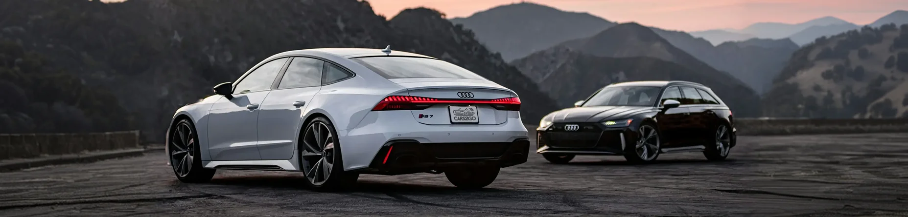 Vehículos premium importado mediante importación de coches de Alemania en carretera de montaña.